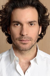 Santiago Cabrera as Informercial Processor in What Happened to Monday (08/2017)