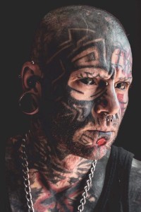 Karl Roy as Man with Face Tattoos in Beau Is Afraid (04/2023)